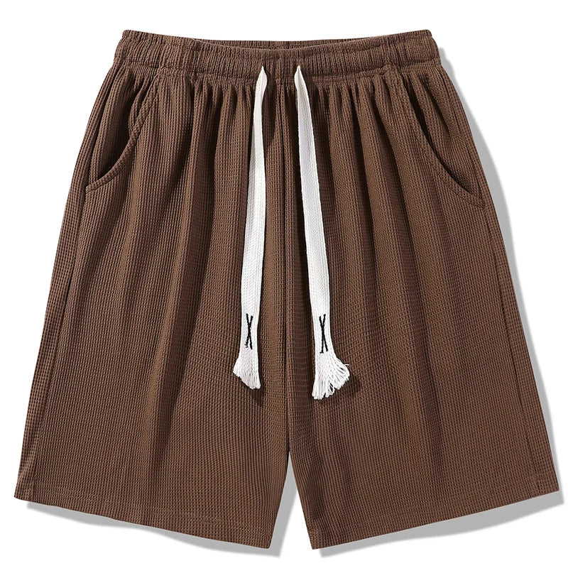 Sports shorts for men in summer  thin ice silk quick drying five quarter pants  fashionable waffle style drawstring shorts